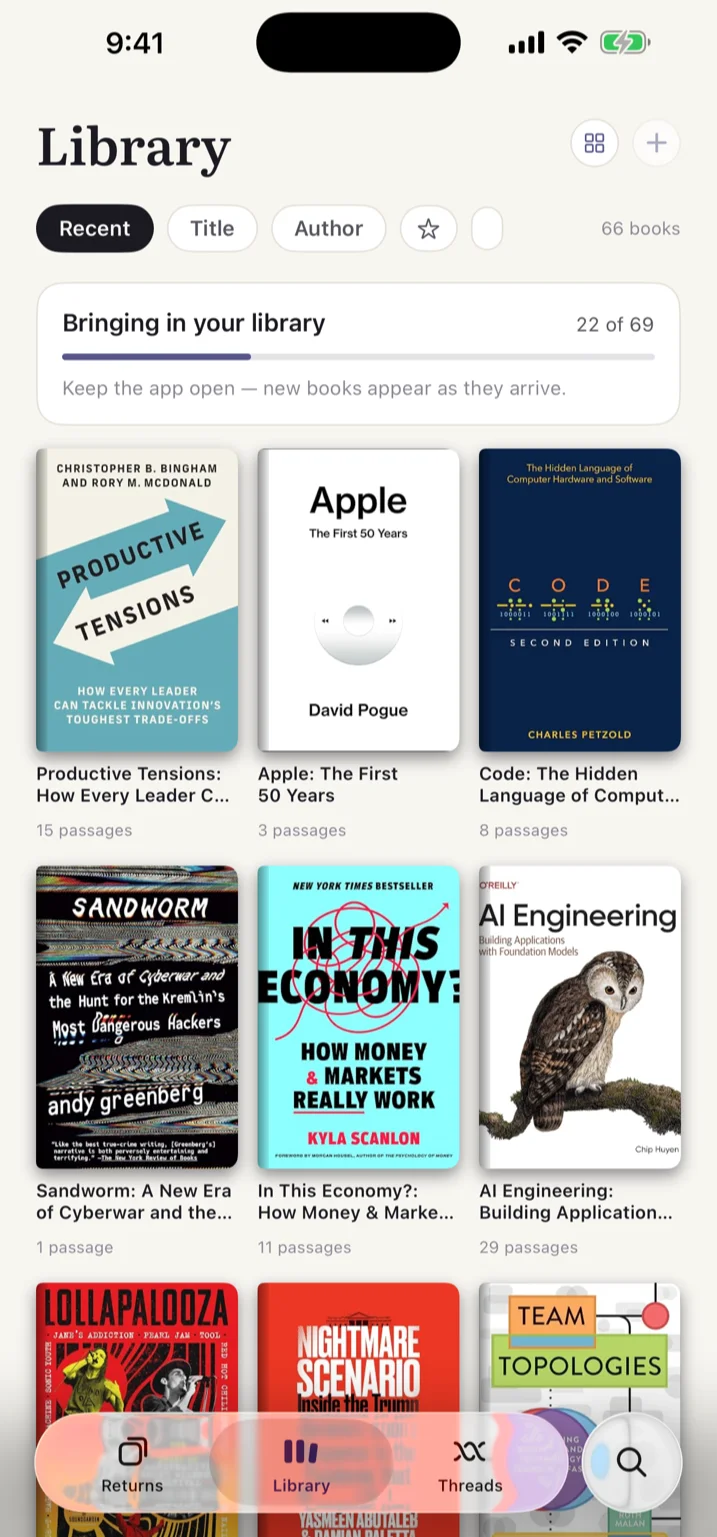 An Amazon import in progress: 'Bringing in your library' with a progress bar, real covers already arriving on the shelf below